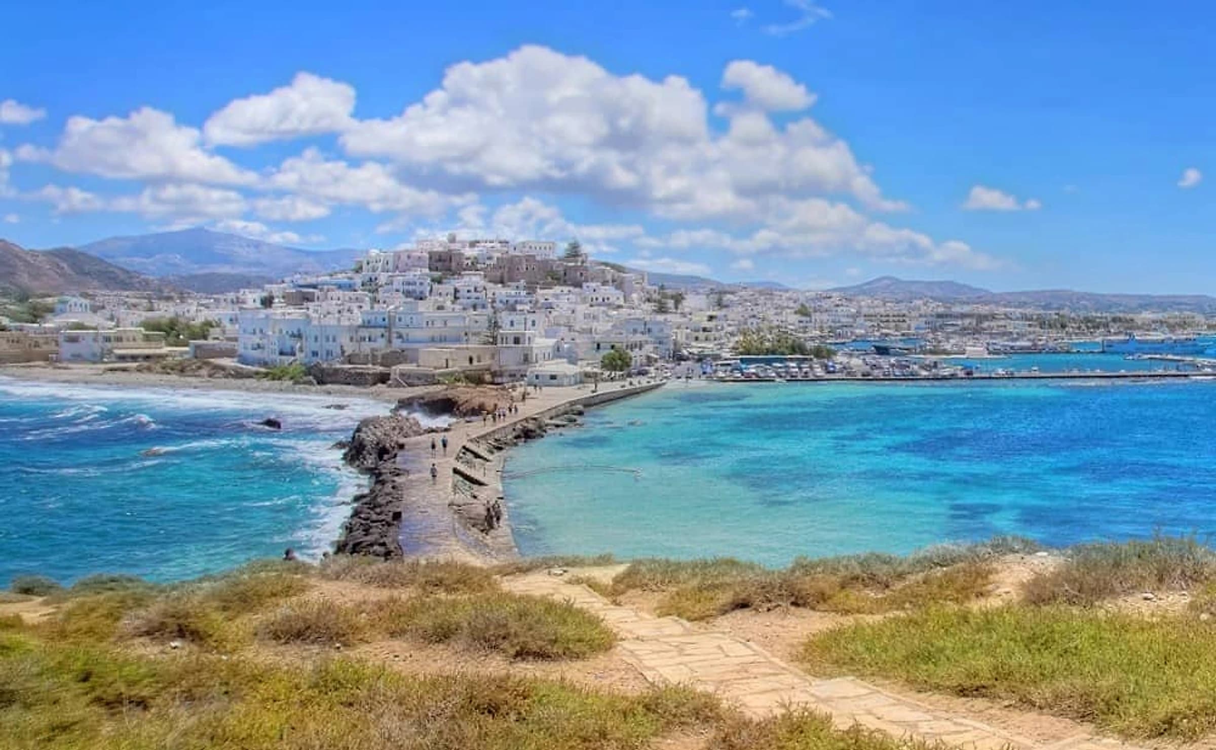 Naxos Chora and the causeway to the Portara islet, seen across the bay
